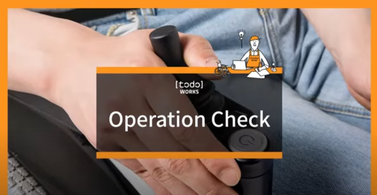 Close up of hand operating a control panel for Todo drive labelled 